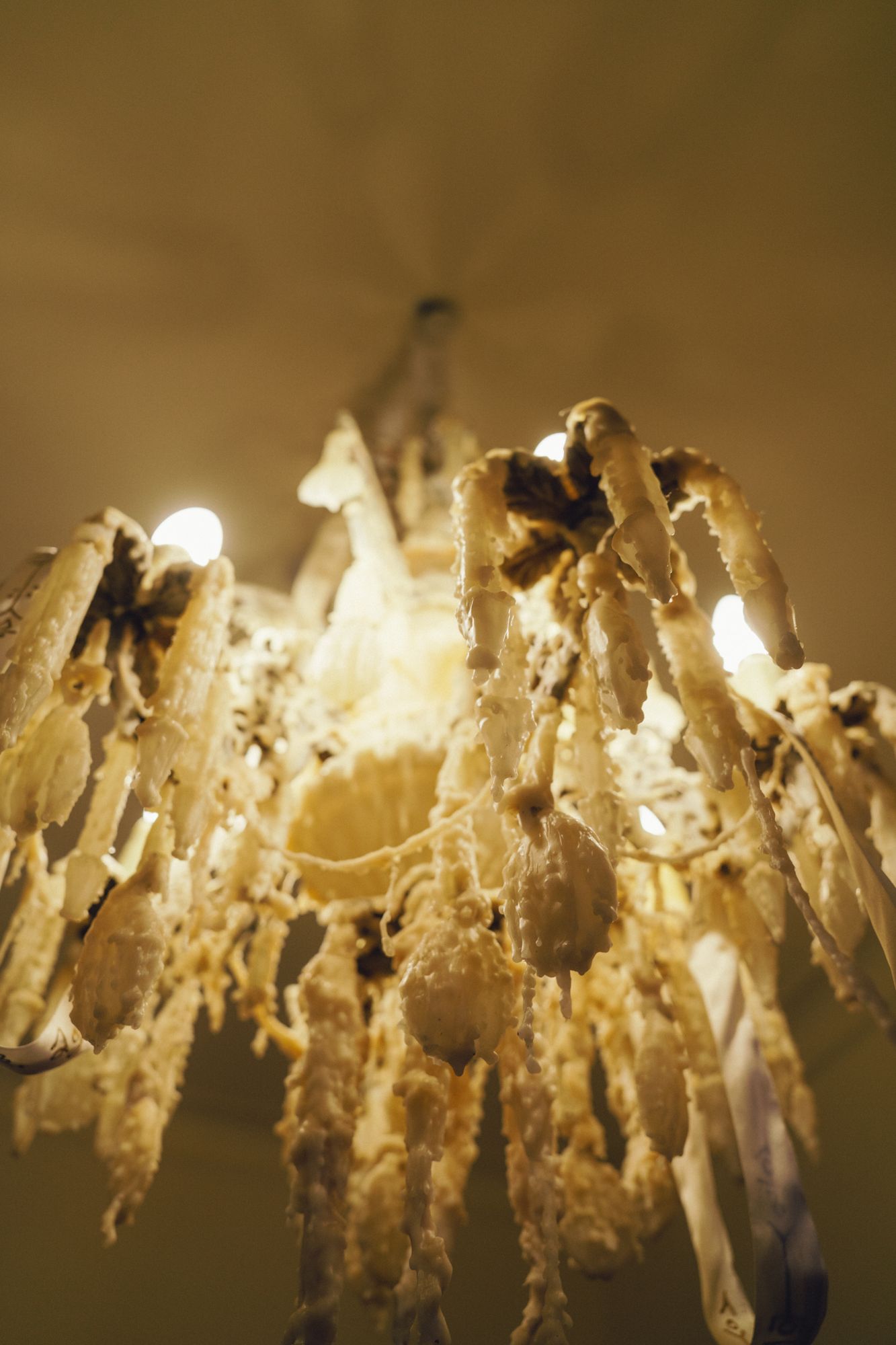 Candelabro seen from below, arms heavy with wax