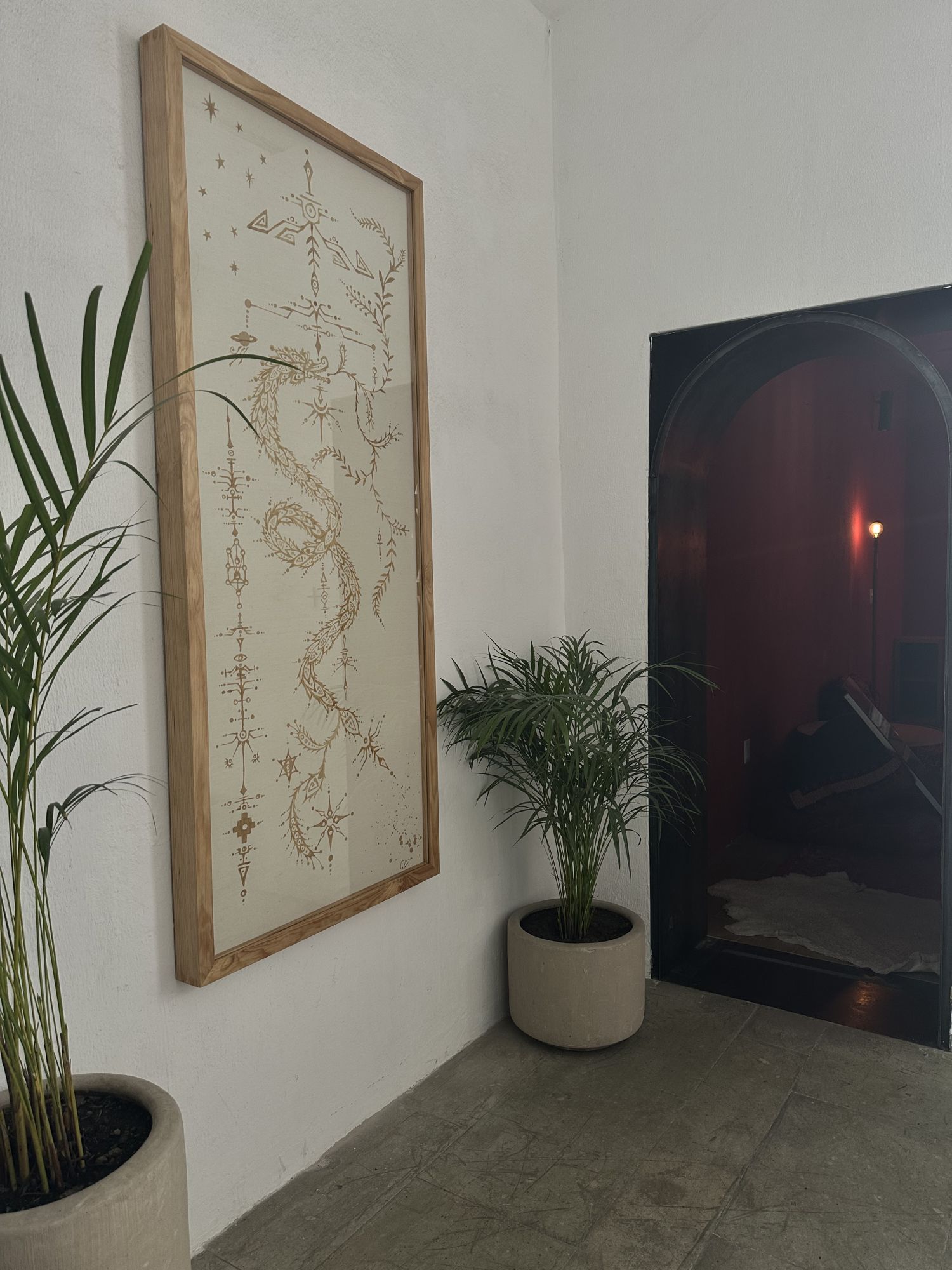 Codex installed beside a doorway and palm