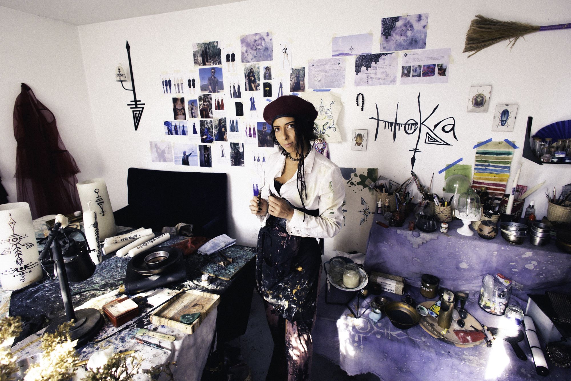 Pau Malo in her studio, surrounded by drawings and material research